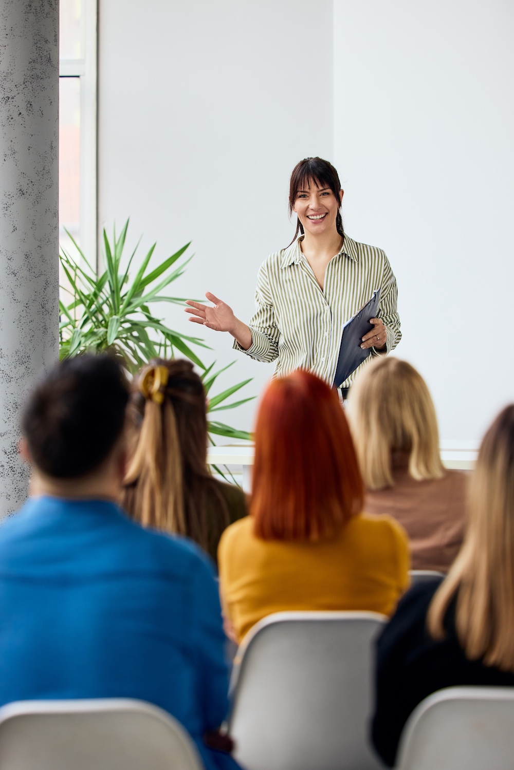 bruce-speaking-at-a-conference woman speaking in front of a crowd representing the CCJF conference