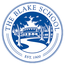 Circular emblem of The Blake School featuring a building and trees in blue and white. Text reads "The Blake School" and "Est. 1900" at the bottom.